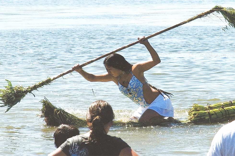 Pictured:  A member of the Big Valley Band of Pomo Indians paddling a traditional canoe.